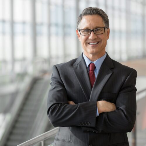 Portrait,Of,A,Handsome,Ceo,Smiling Interim Executive Seeking Opportunity